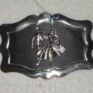 Sq dance BUCKLE 3D dance pair on black leather in sculpted silver frame